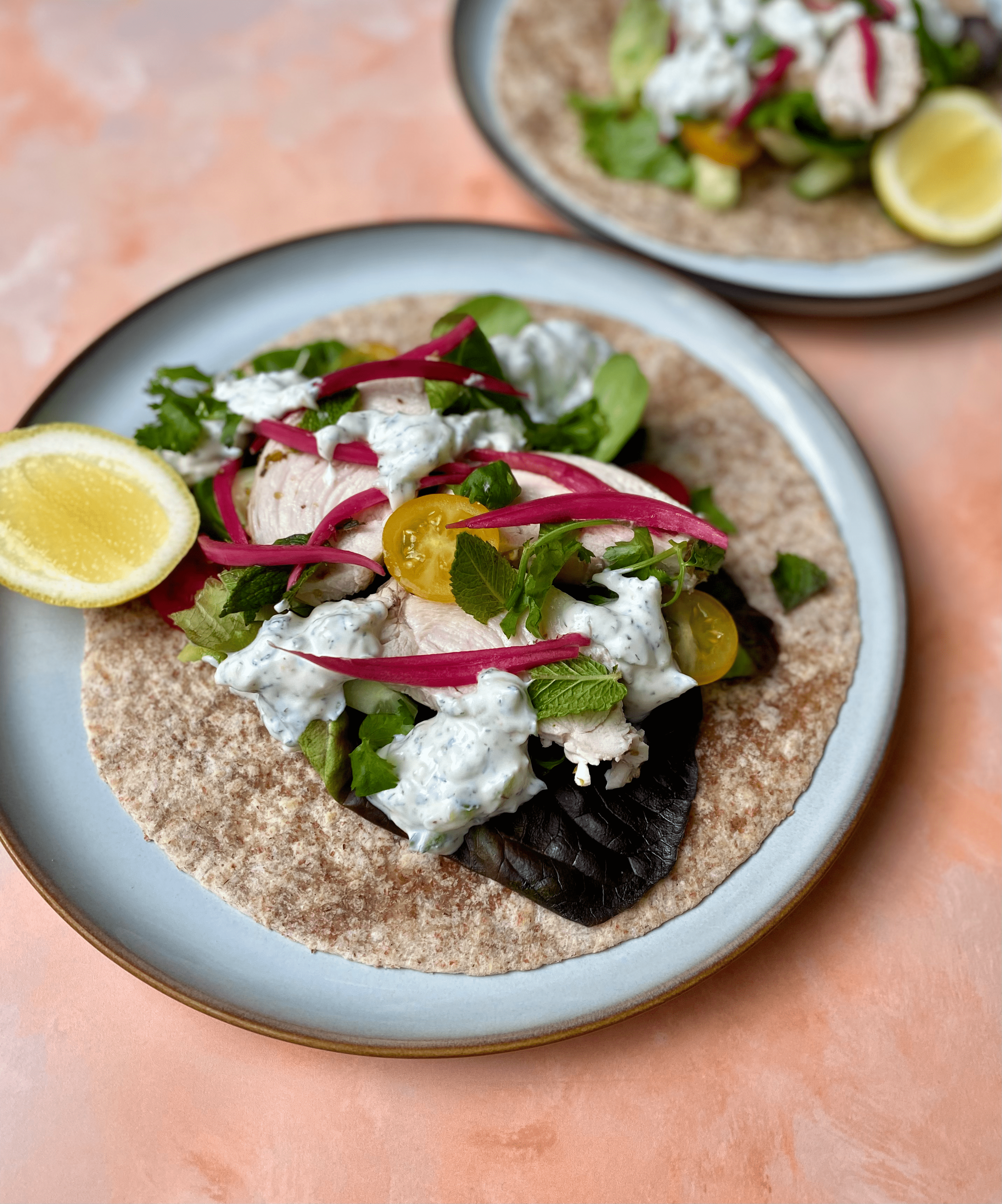 Greek-Style Chicken Wraps with Herby Yoghurt & Pickled Onions - Oven-baked oregano chicken, crisp salad, tangy yoghurt-herb sauce and zingy pickled onions swaddled in soft whole-meal wraps.  A satisfying 20-minute prep meal that balances lean protein, slow-release carbs and plenty of fresh veg for blood-sugar-friendly energy.
