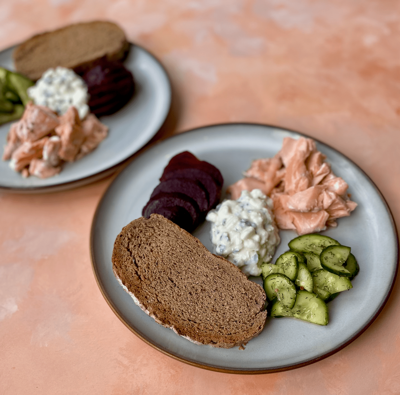 Scandinavian-Style Lunch - A light, fresh and balanced Nordic-inspired lunch featuring baked salmon, beetroot, quick pickled cucumber and herby cottage cheese, served with crunchy rye toast.